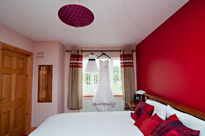 wedding dresses hanging on rail